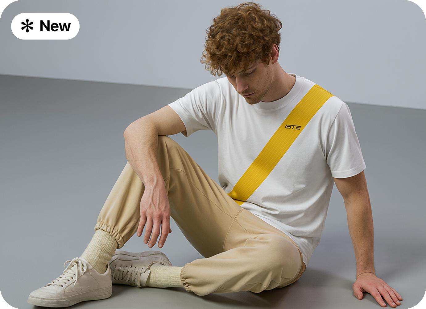 Model wearing GT3 tee seated